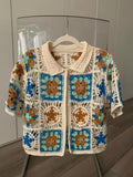 Cropped granny-square crochet cardigan from the Azure Bloom pattern — checkerboard of flower and lace-star motifs with shirt collar